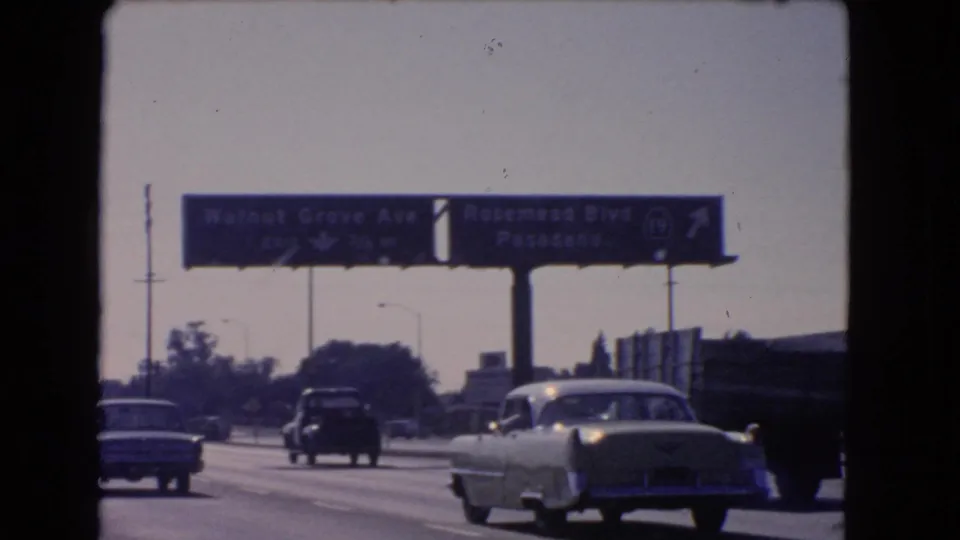 1966 California highway view with mid-century cars moving toward signs for Walnut Grove Ave and Rosemead Blvd Pasadena.