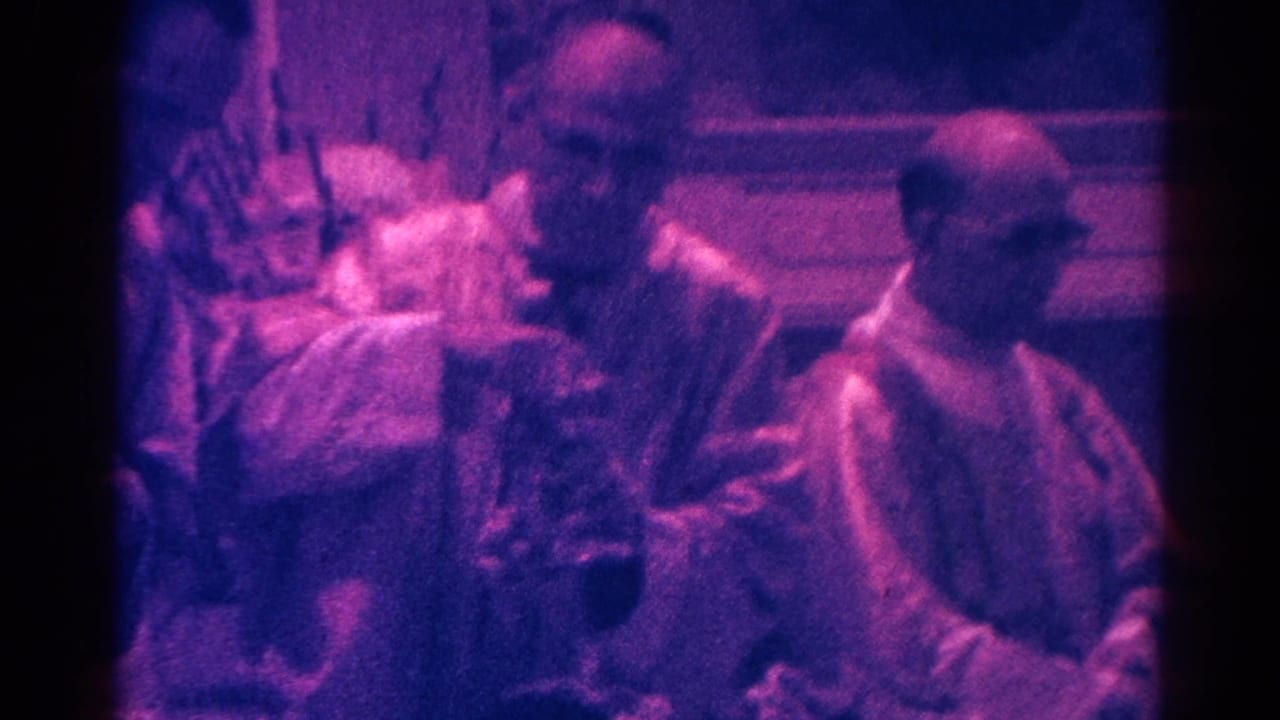 Catholic clergy in a Danville church interior appear to handle a chalice during the 1966 Mass footage.