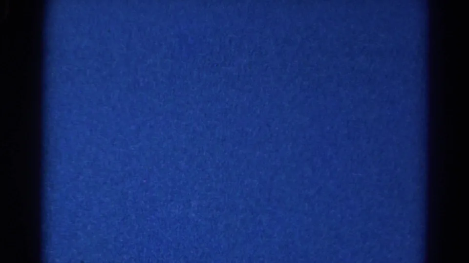 Final sampled frame from the 1966 Danville clip remains mostly blue low-light 8mm texture with no visible players or field detail.