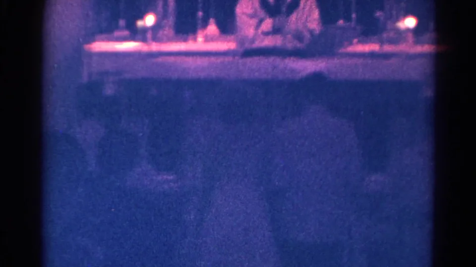 The final frame shifts inside the Danville chapel, showing a blue-toned altar view with candles and a priest-like figure.