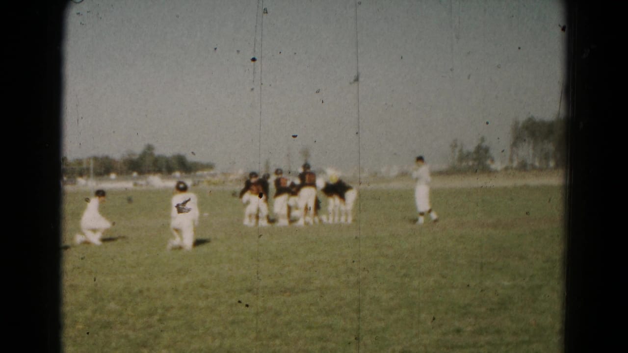 Youth football teams appear to reset near the line of scrimmage in 1966 Hagerstown 8mm home-movie footage.