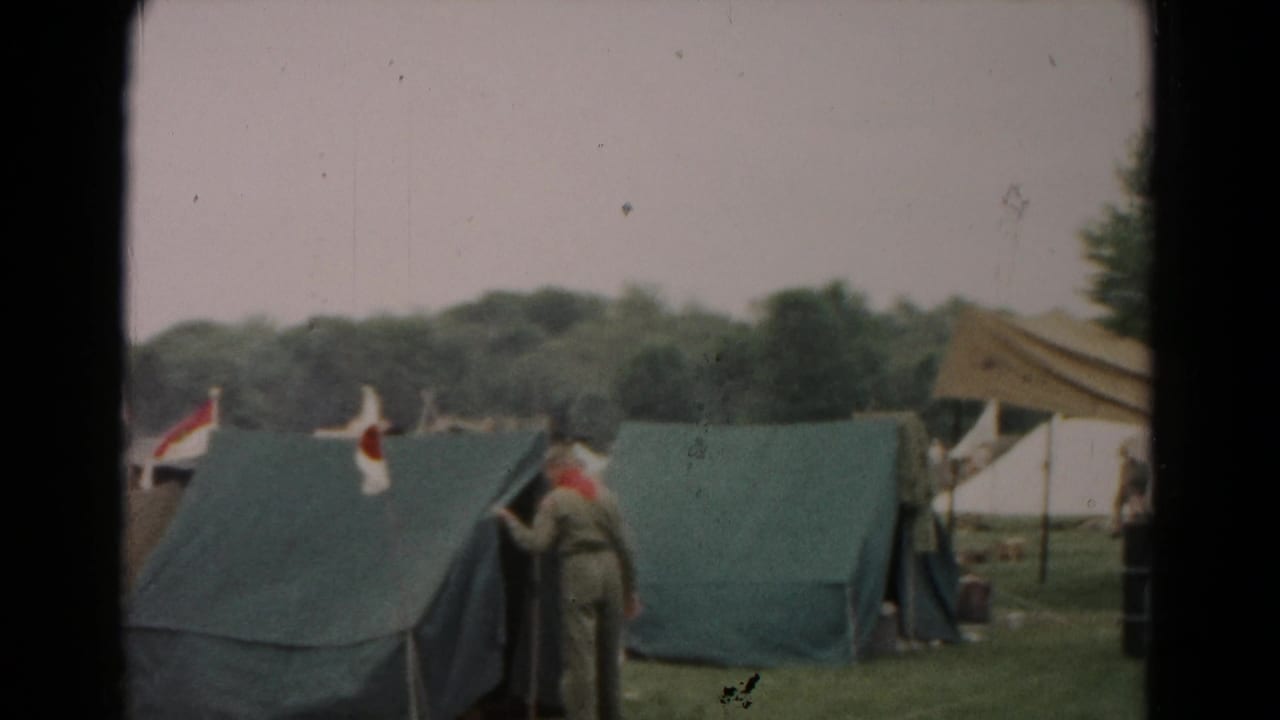 Uniformed scout-style figures stand by green tents and a canopy in the 1966 Hagerstown camp scene.