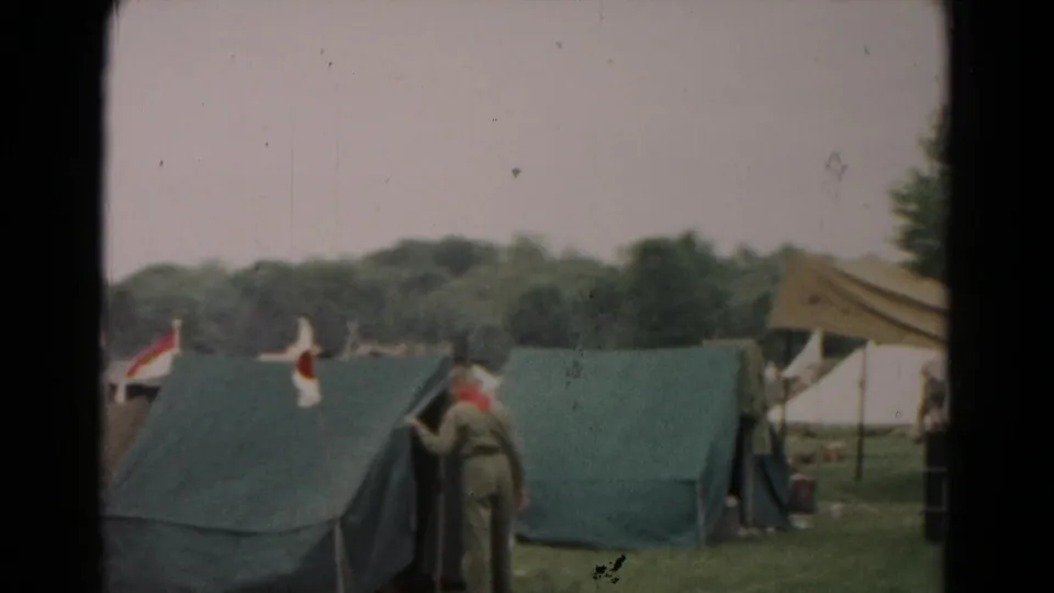 Uniformed scout-style figures stand by green tents and a canopy in the 1966 Hagerstown camp scene.
