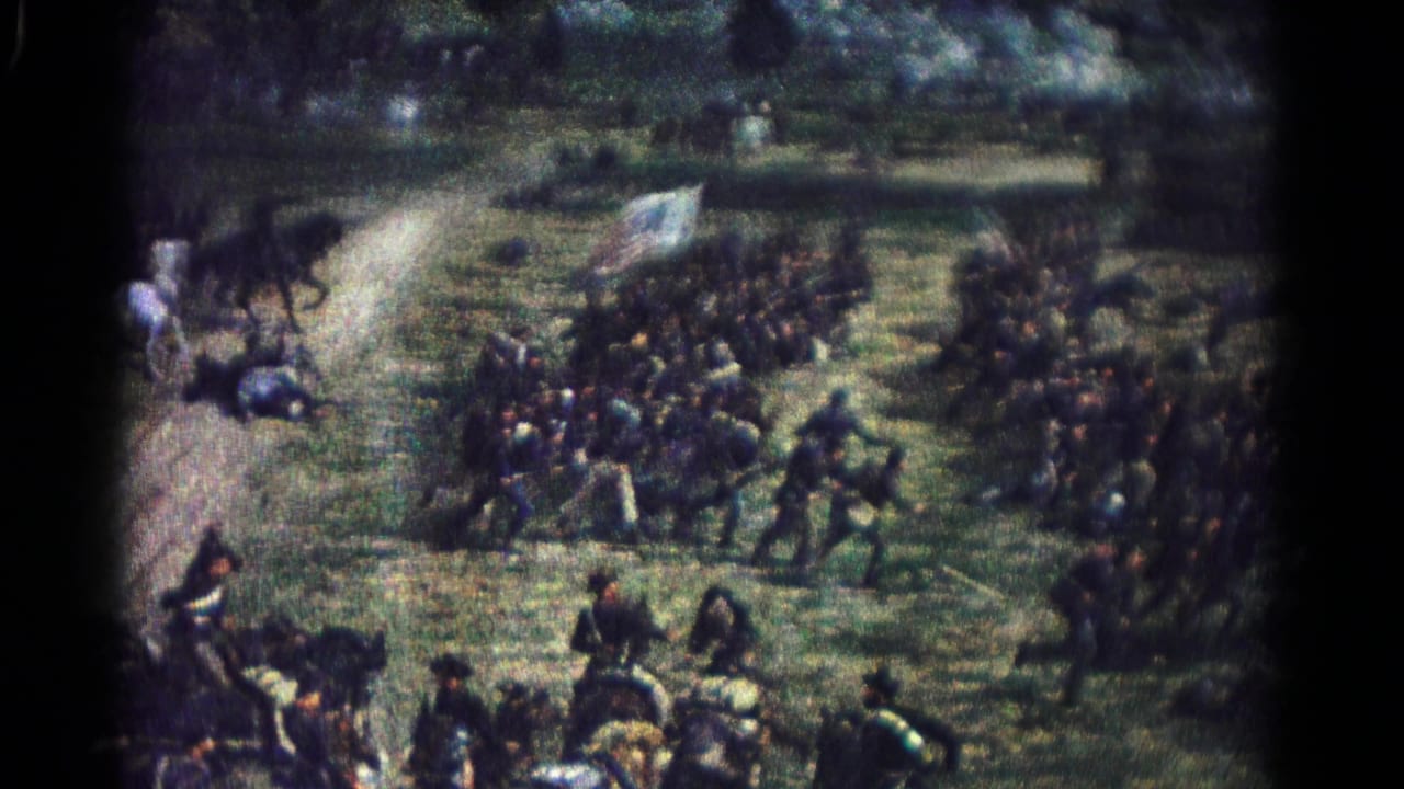 Painted infantry and cavalry figures gather around a flag in a Civil War battle scene.