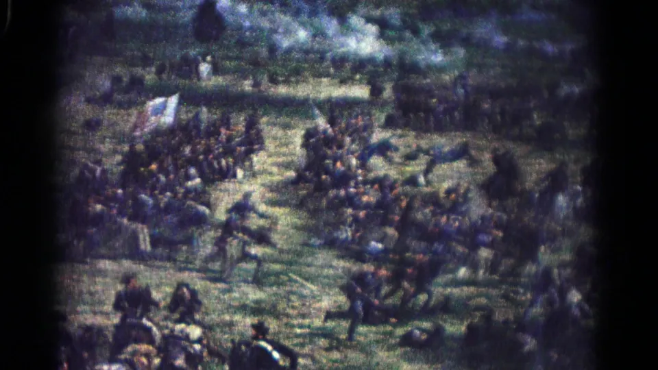 The 1966 home-movie frame records a painted Civil War battle with advancing figures, mounted soldiers, a flag, and smoky brushwork.