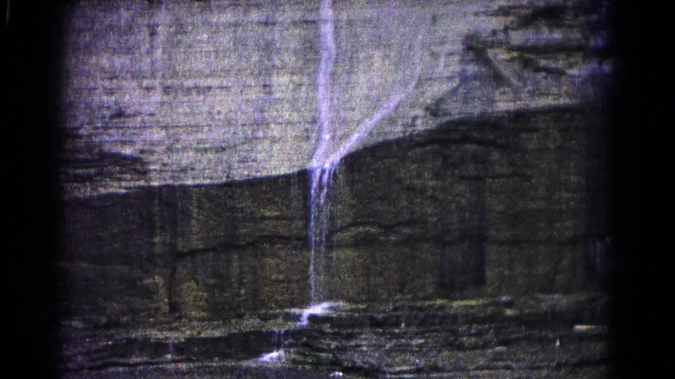 1966 Hagerstown view of a narrow cascade crossing layered rock and pooling or flowing across the lower ledge.