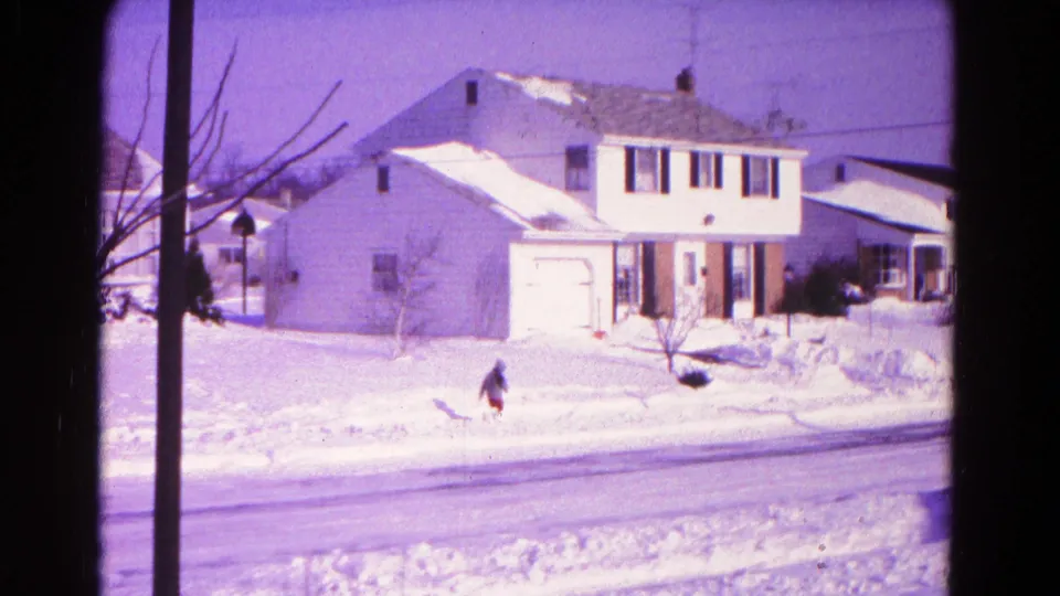 The final frame shows a bundled figure near the snowbank across a residential street in 1966 Hagerstown, Maryland.