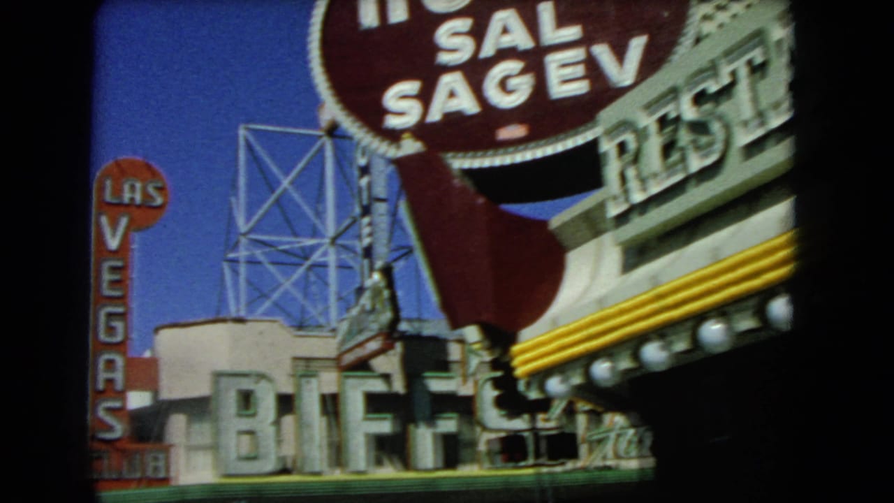 Las Vegas casino signage seen from a moving vehicle, including Hotel Sal Sagev and Biff's Club.