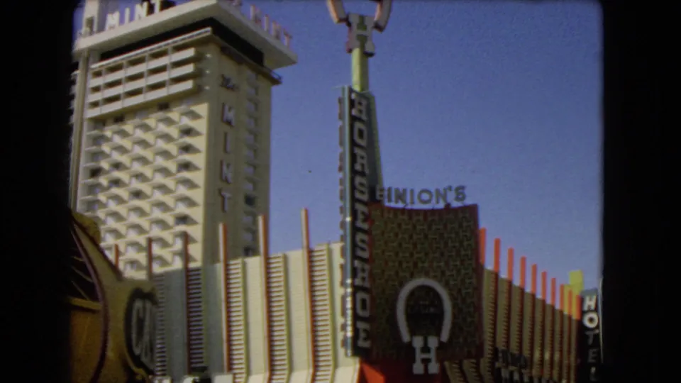 1966 Las Vegas view showing the Mint tower and Horseshoe signage against a clear blue sky.