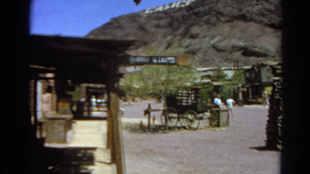 Silver Lake, California footage shows a Western-themed street with visitors, a wagon display, rustic structures, and a stone sign.