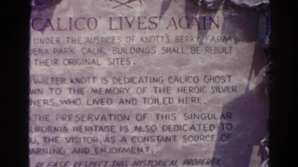 Close 8mm view of the Calico inscription, including partial lines about Walter Knott, Calico Ghost Town, and silver miners.