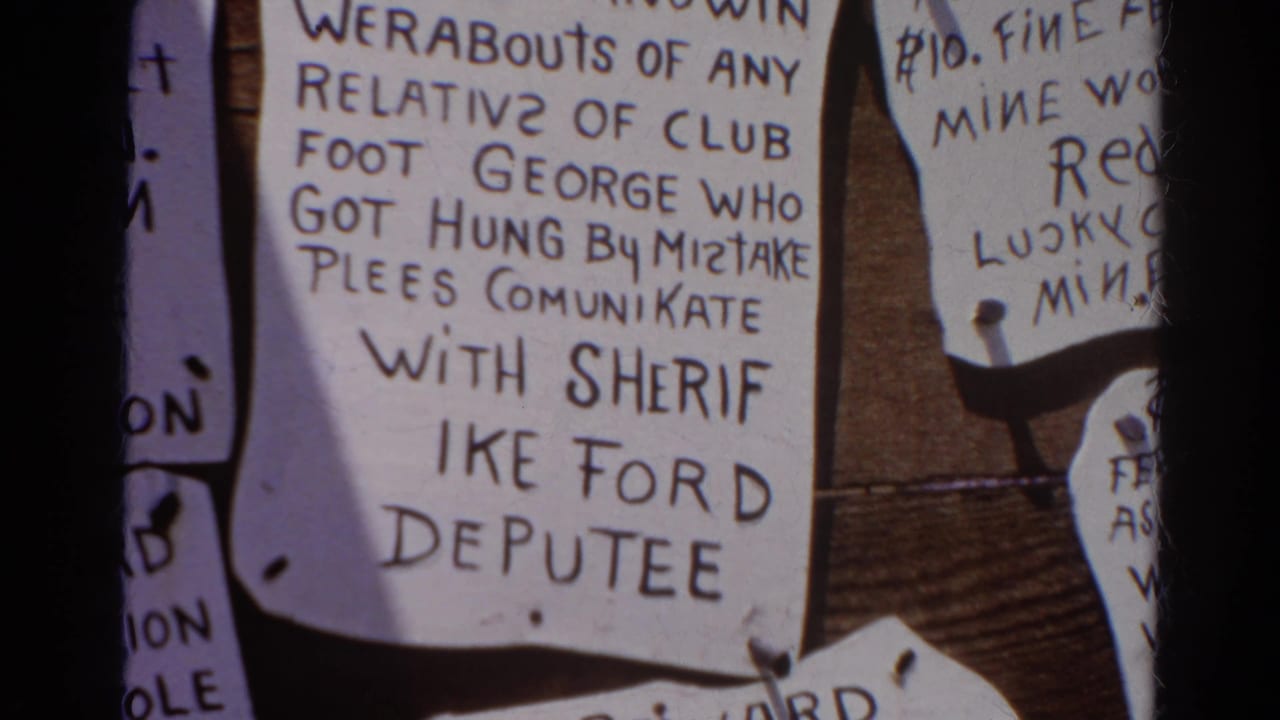 Handwritten notice about Club Foot George and Sheriff Ike Ford on a board.