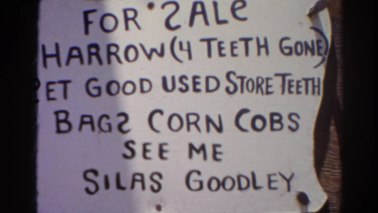 1966 Silver Lake 8mm frame showing a close handwritten for-sale sign with spelling errors, pinned paper, dark lettering, and the name Silas Goodley.