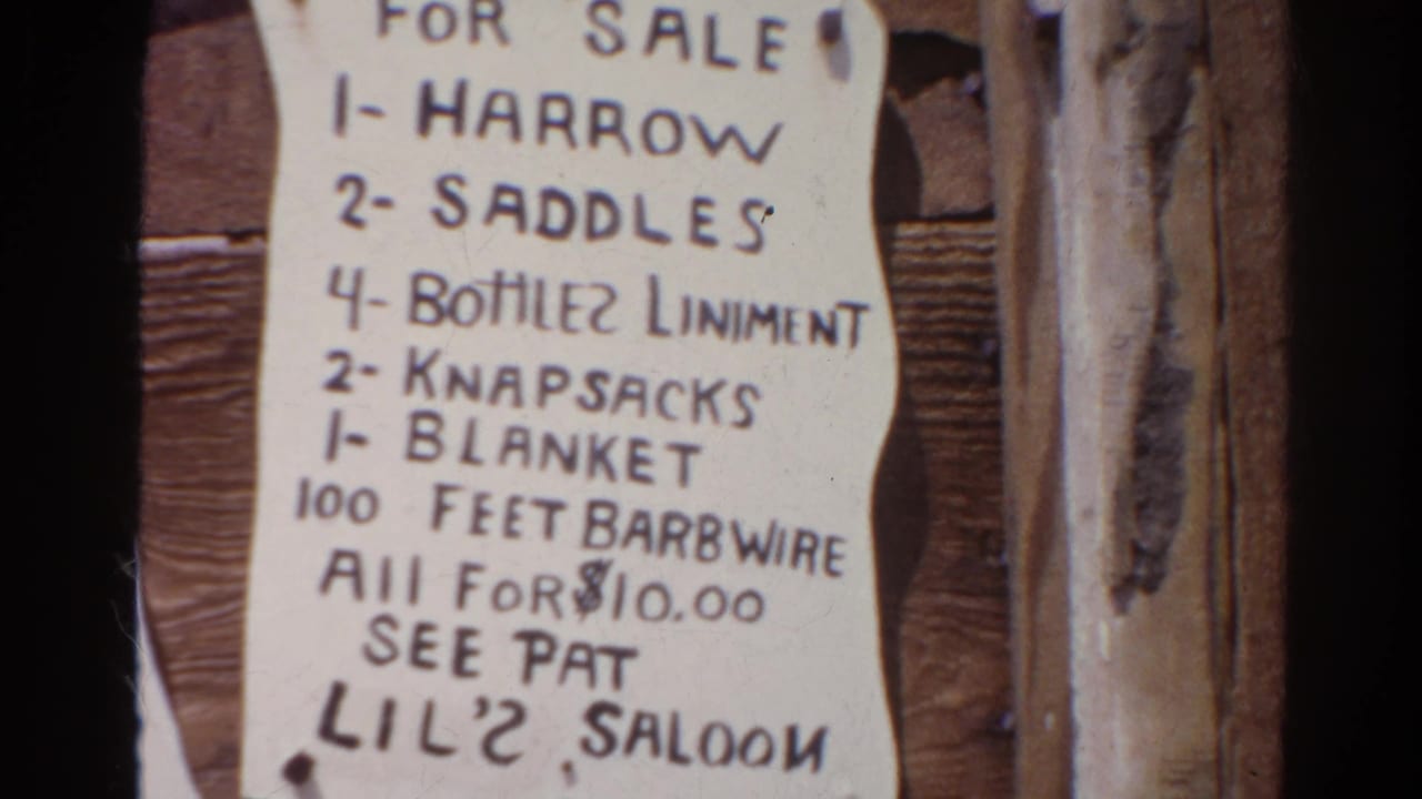 Close view of the same sale sign with item list and saloon instruction.