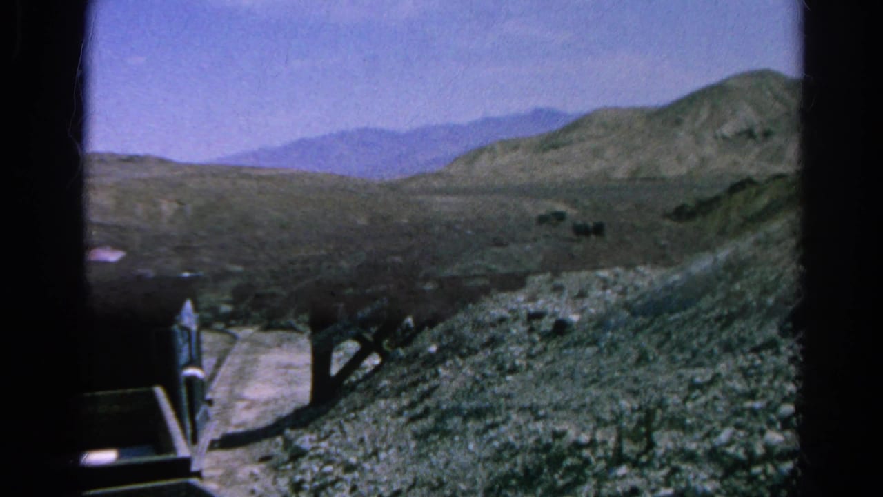 End-frame view from the 1966 funicular ride, with the car edge at left and a dry rocky Silver Lake slope beyond.