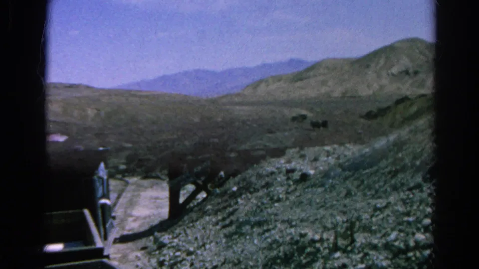 End-frame view from the 1966 funicular ride, with the car edge at left and a dry rocky Silver Lake slope beyond.