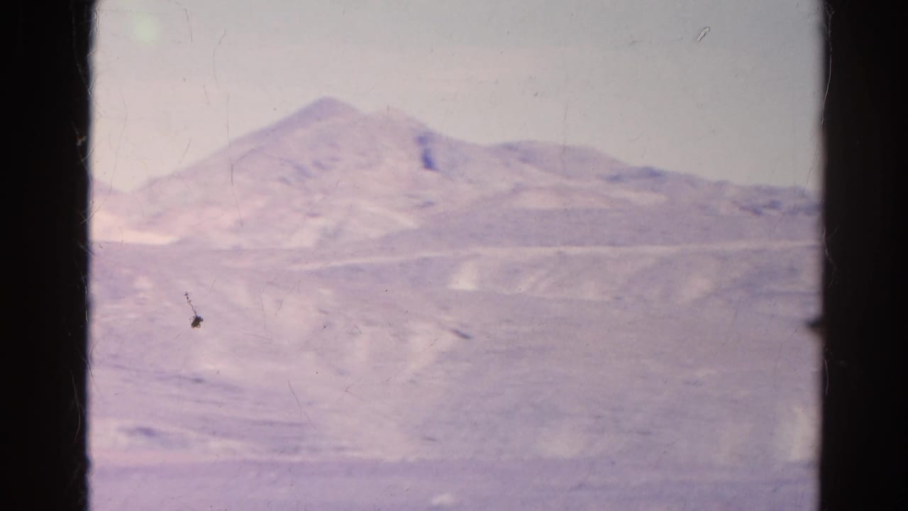 A broad 1966 Silver Lake desert view shows distant mountains, sandy washes, and a faded purple-pink 8mm color cast.