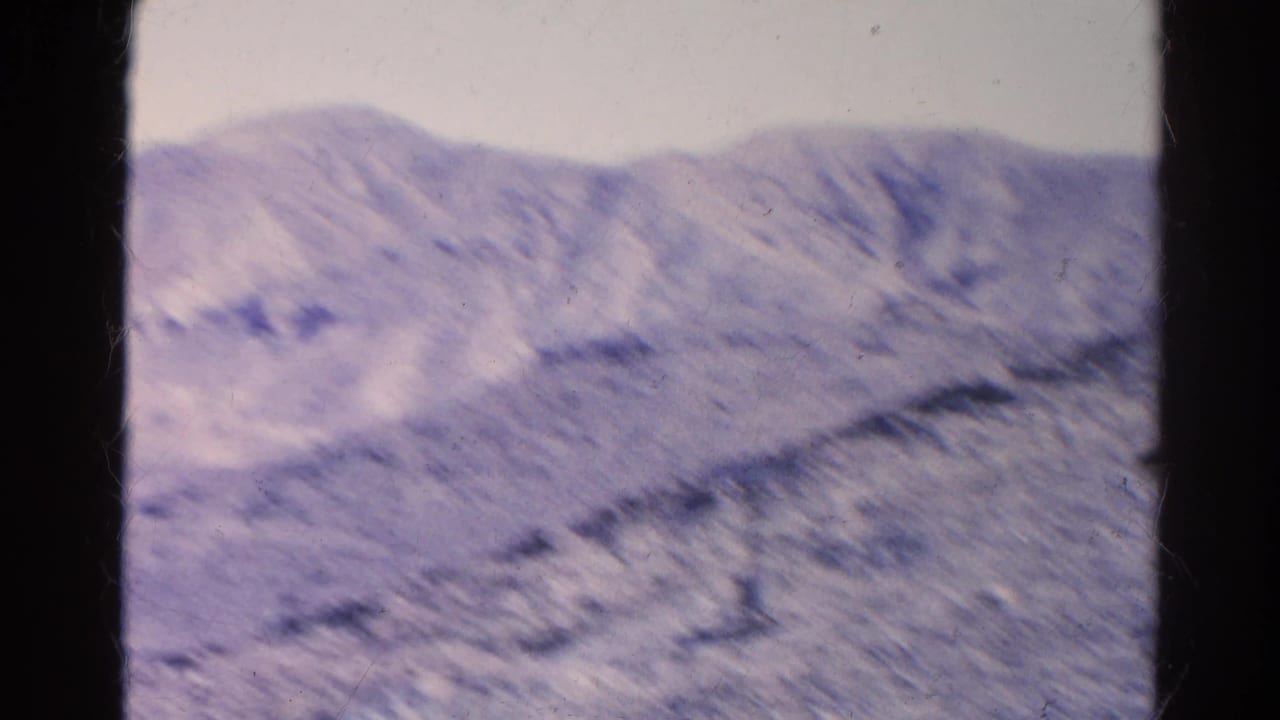 Final 1966 8mm frame shows dry ridged terrain and distant slopes in the Silver Lake, California region, with visible film texture.