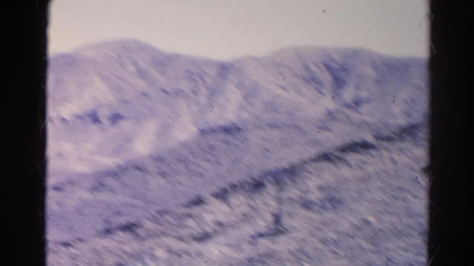 Final 1966 8mm frame shows dry ridged terrain and distant slopes in the Silver Lake, California region, with visible film texture.