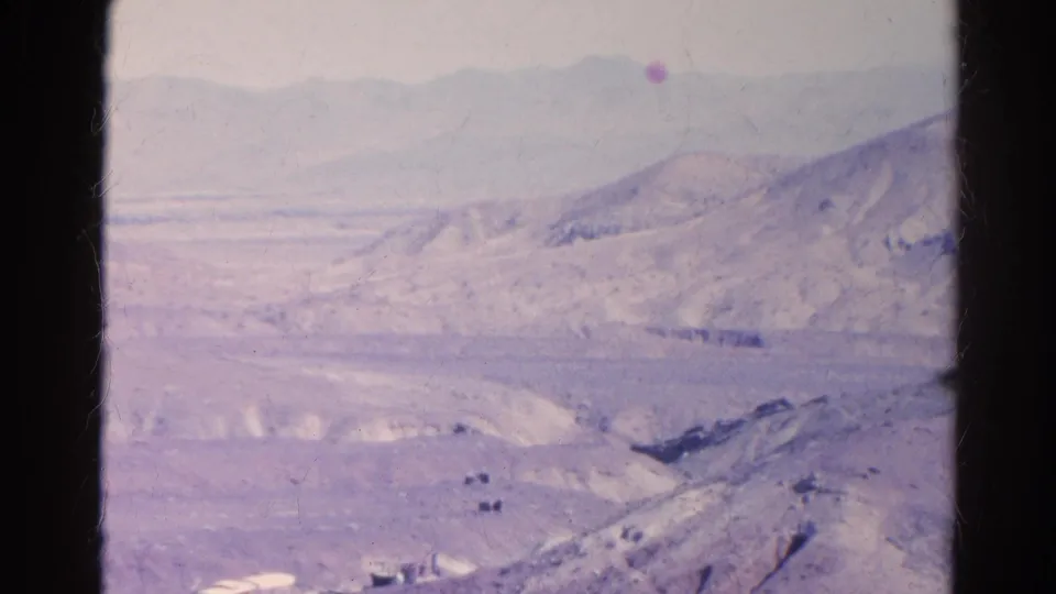 1966 Silver Lake, California home-movie view of arid hills, valley terrain, and hazy mountains with visible film wear.