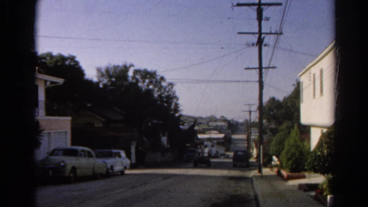 1966 Silver Lake street scene with parked mid-century cars, houses, a utility pole, overhead wires, sidewalk, and trees.