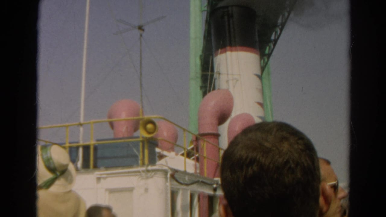 Steamship deck details with smokestack, pink vents, yellow railing, and spectator heads in the foreground.