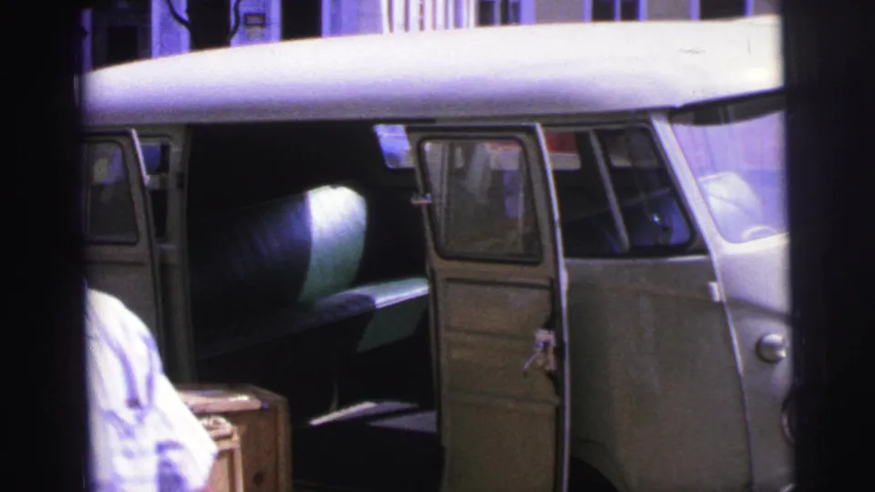 Close 1967 Brazil street view of the open van door, interior bench, and crates during unloading.