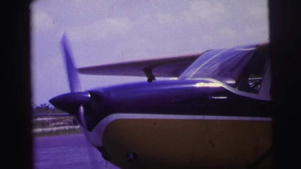 A final side view shows the parked single-engine aircraft's cockpit windows, wing strut, and blue and yellow fuselage.