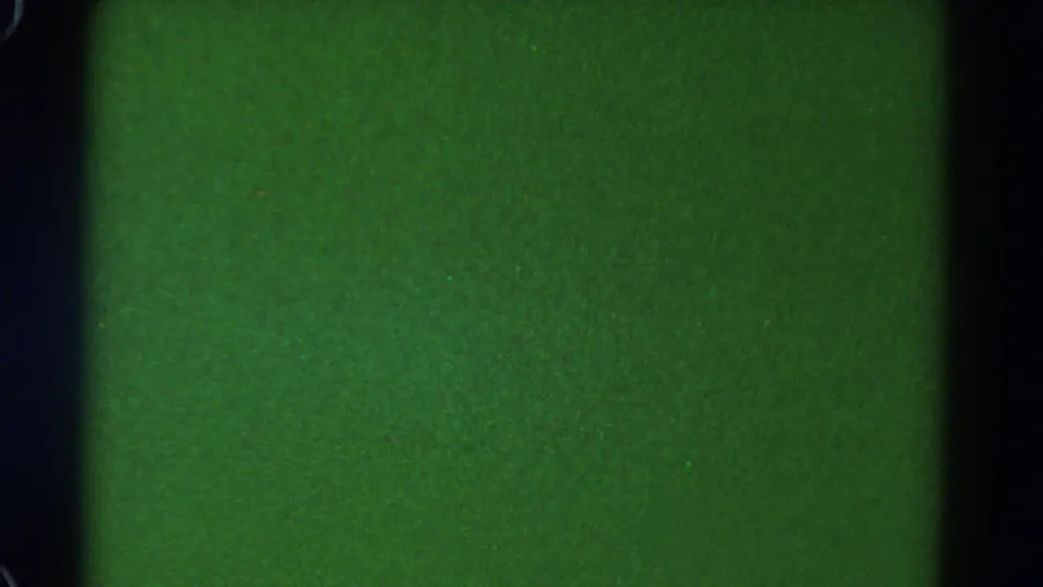 1967 Colorado 8mm frame showing green exposed film texture with dark gate borders and visible grain.