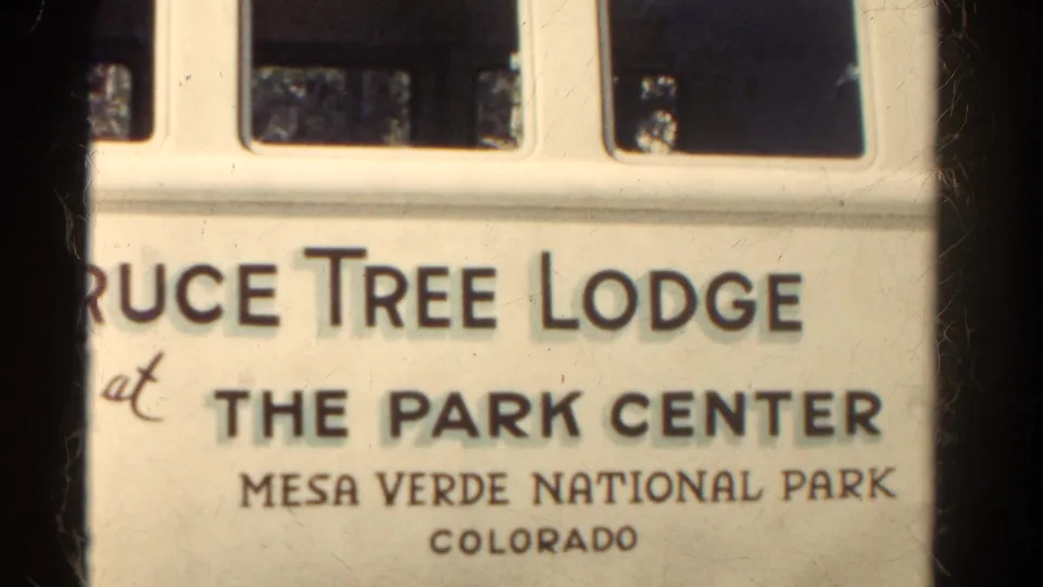 Partial 8mm close-up of the Pruce Tree Lodge sign, with Mesa Verde National Park and Colorado text visible.