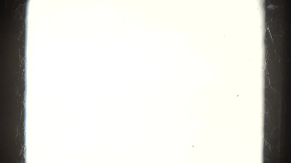 Start frame from a 1967 Colorado 8mm train-travel clip, mostly blown out with film gate edges and a partial mountain view.
