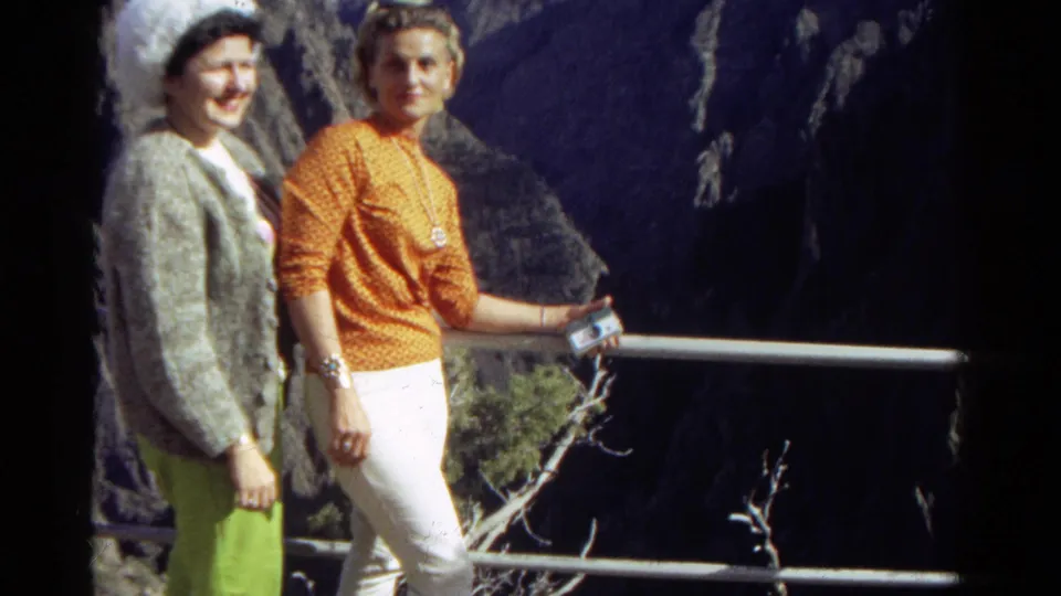 The final frame shows two women at a Colorado scenic overlook, one in an orange top and white pants, beside a railing and rocky canyon.