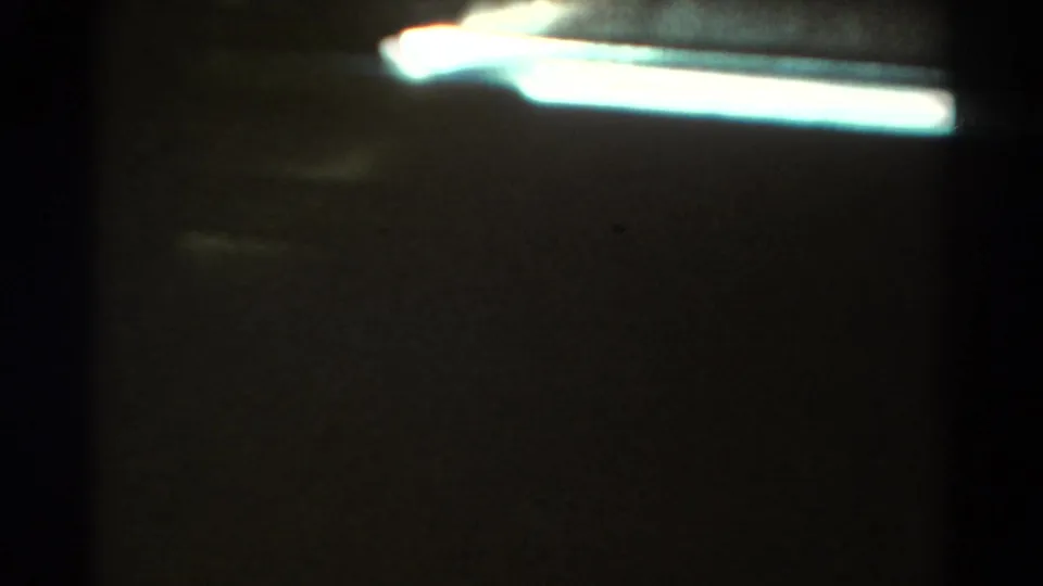 Opening 1967 Colorado 8mm frame with dark interior or frame edge obscuring much of the passenger-window view.