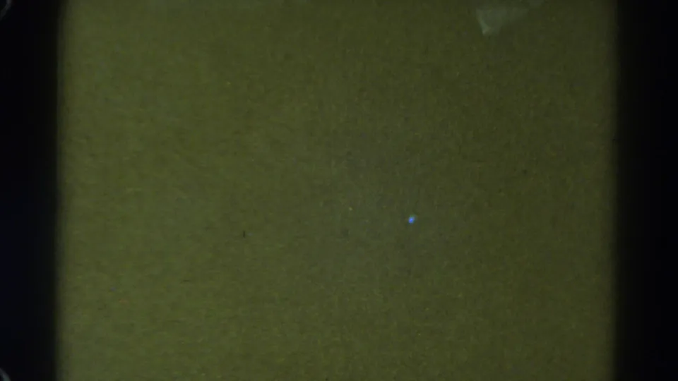1967 Colorado 8mm frame with a dark, underexposed field, black gate-like borders, and visible dust or scratches.
