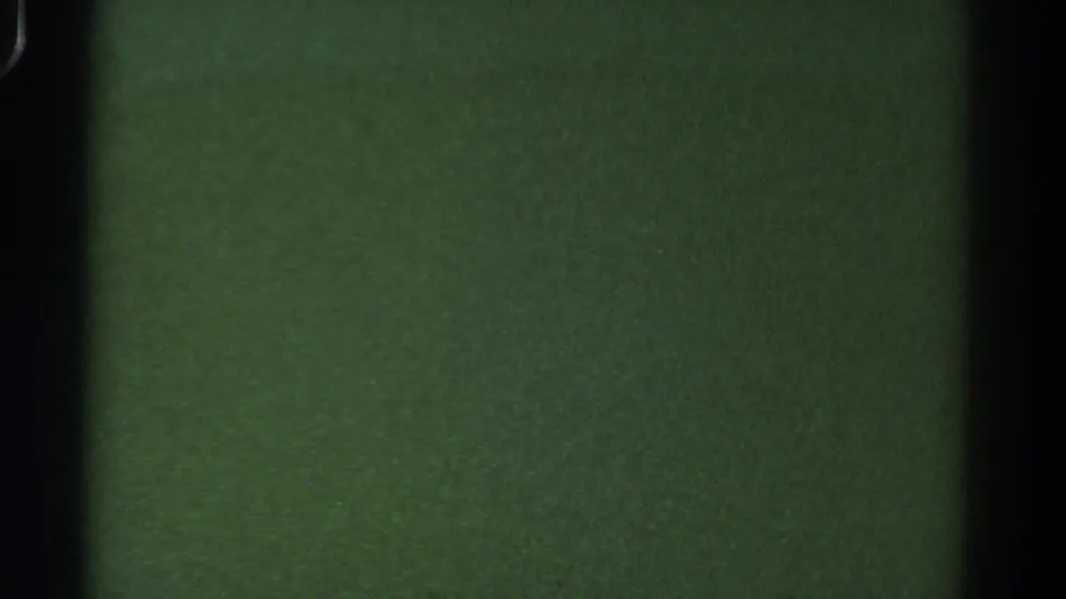 1967 Colorado 8mm frame showing a darker murky underwater field with grain, specks and film borders.