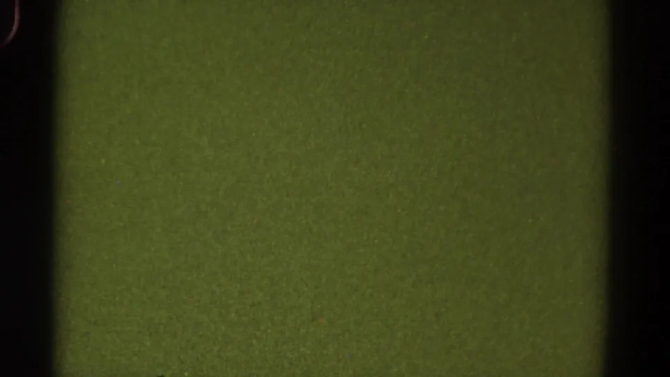 1967 Colorado 8mm home-movie frame showing green analog texture, black edge shadow, grain, and a faint contact-sheet division.