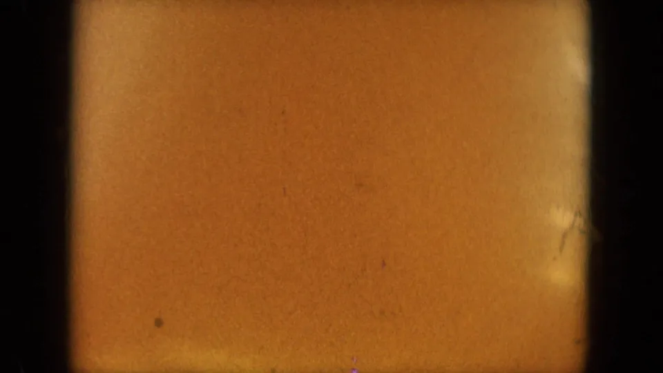 The final frame is a warm, soft 8mm close-up with the woman's face mostly obscured near the right edge.