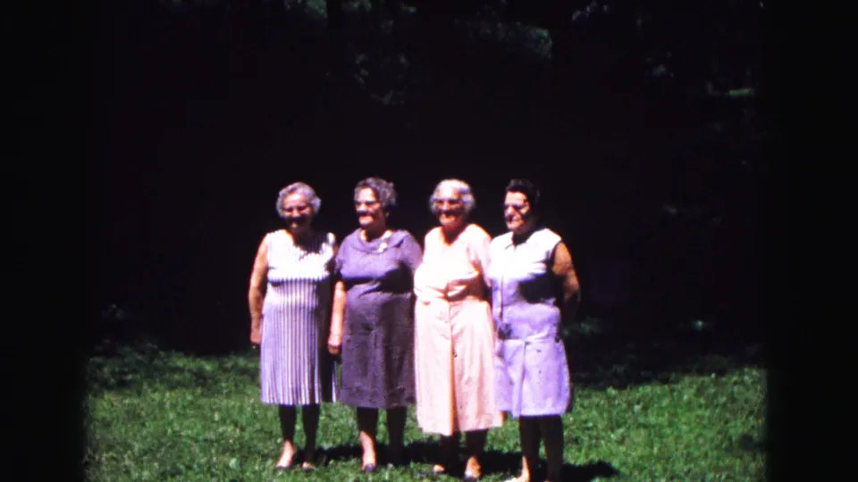 Four older women face the camera in a sunlit garden pose, consistent with the 1967 Galena, Illinois metadata for this home movie.