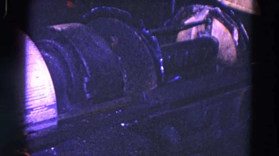 1967 Trenton 8mm frame showing a blue-purple industrial machine close-up with a cylindrical component and connected metal housings.