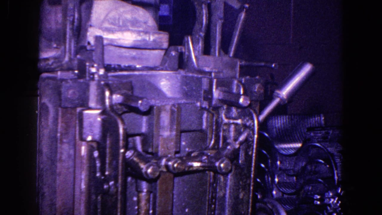Close view of heavy machinery with levers and metal fittings.