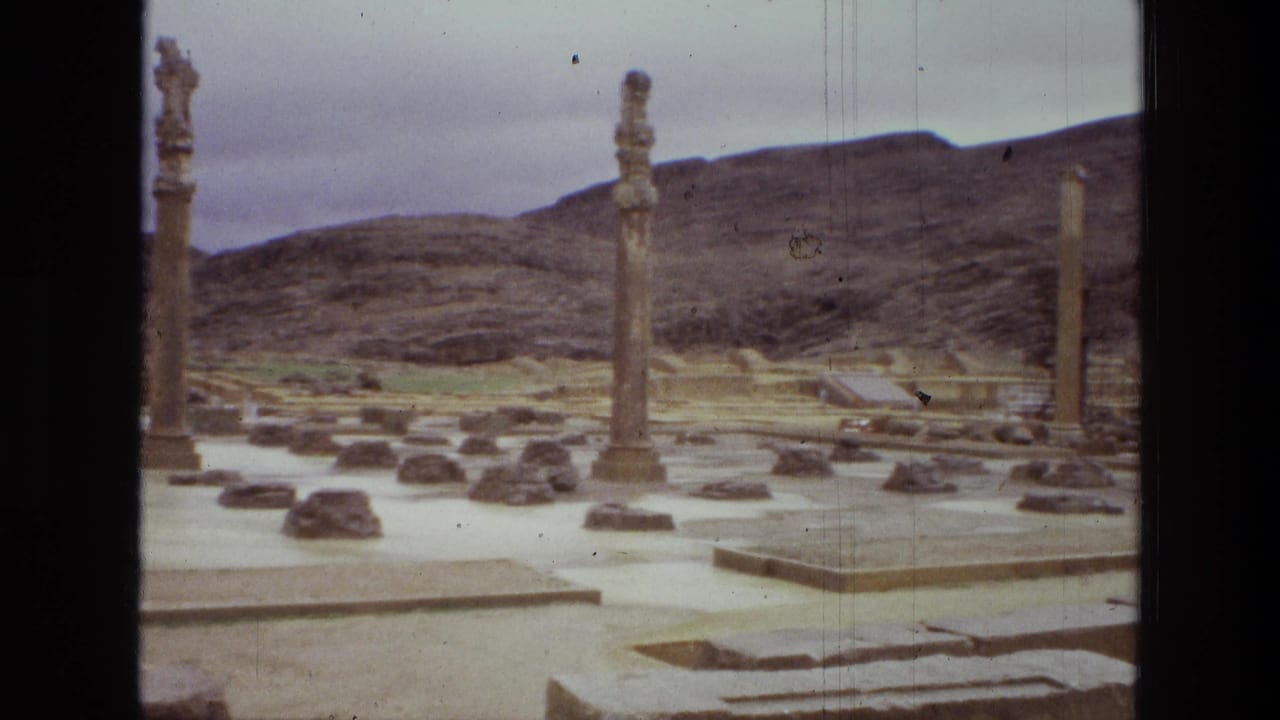 Stone columns and scattered ruins in a dry archaeological landscape.