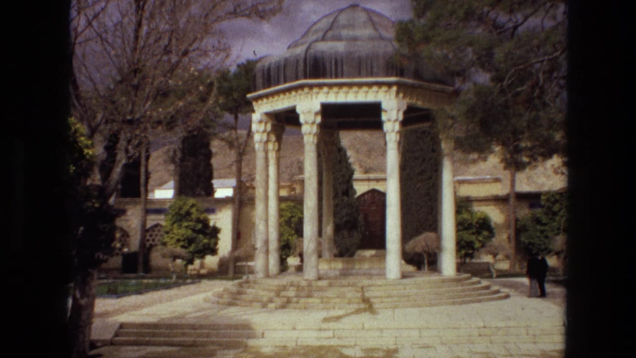 1972 Iran 8mm frame showing a domed Persian-style pavilion on stone steps, with trees, shrubs, and a small visitor nearby.