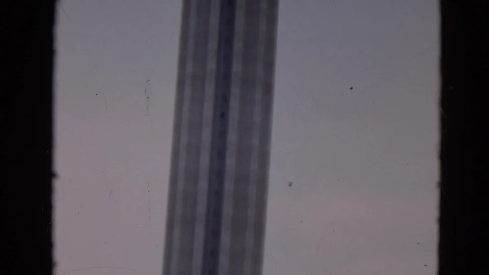 Low-angle visitor footage shows the Space Needle columns leading up to the circular observation deck.