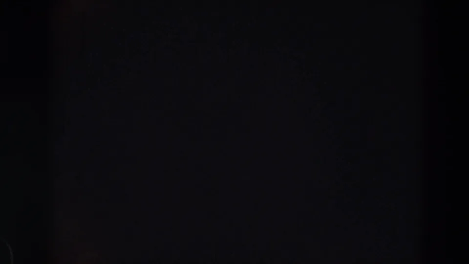 Final sampled frame is largely black with faint gray film texture and no visible people, logos, or location markers.