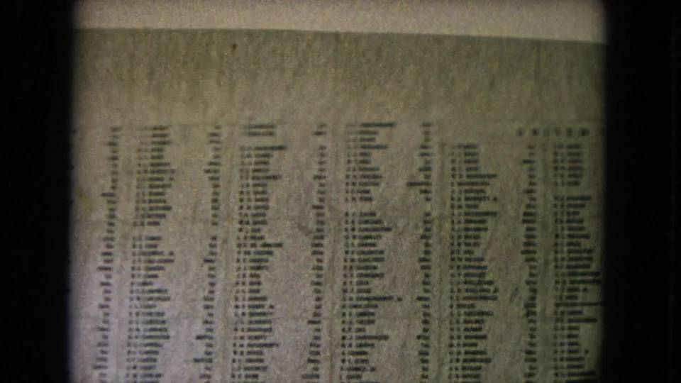 Lower portion of the Honolulu U.S.S. Arizona Memorial inscription wall, filmed in grainy 8mm color.