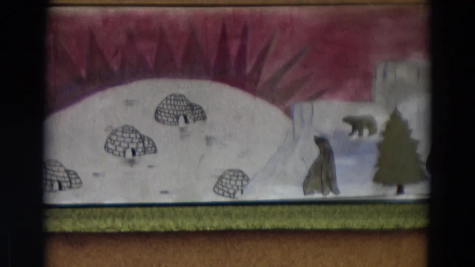 1968 Lahaina, Maui home-movie frame of the puppet-show backdrop after the sled puppet has moved out of view.