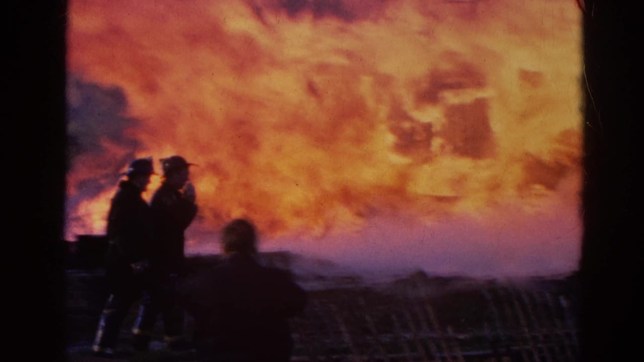 Helmeted silhouettes stand near a large blaze framed by dark structural edges.