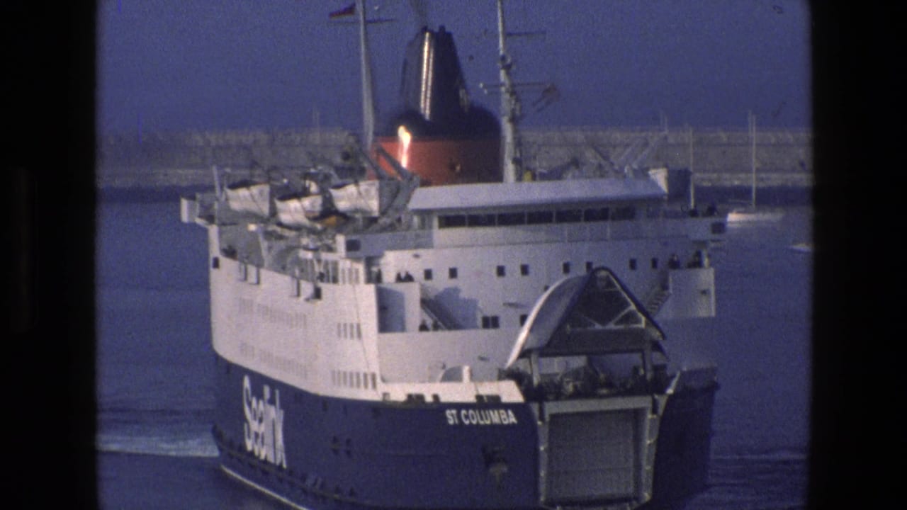 Sealink ferry St Columba approaching harbor water with stern ramp visible.