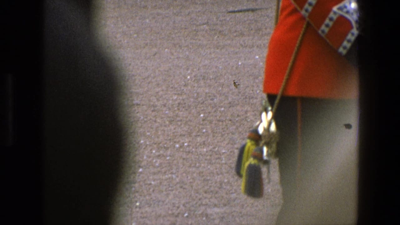 Two ceremonial guards in red tunics appear at the edges of a 1969 England frame, separated by dark window framing.