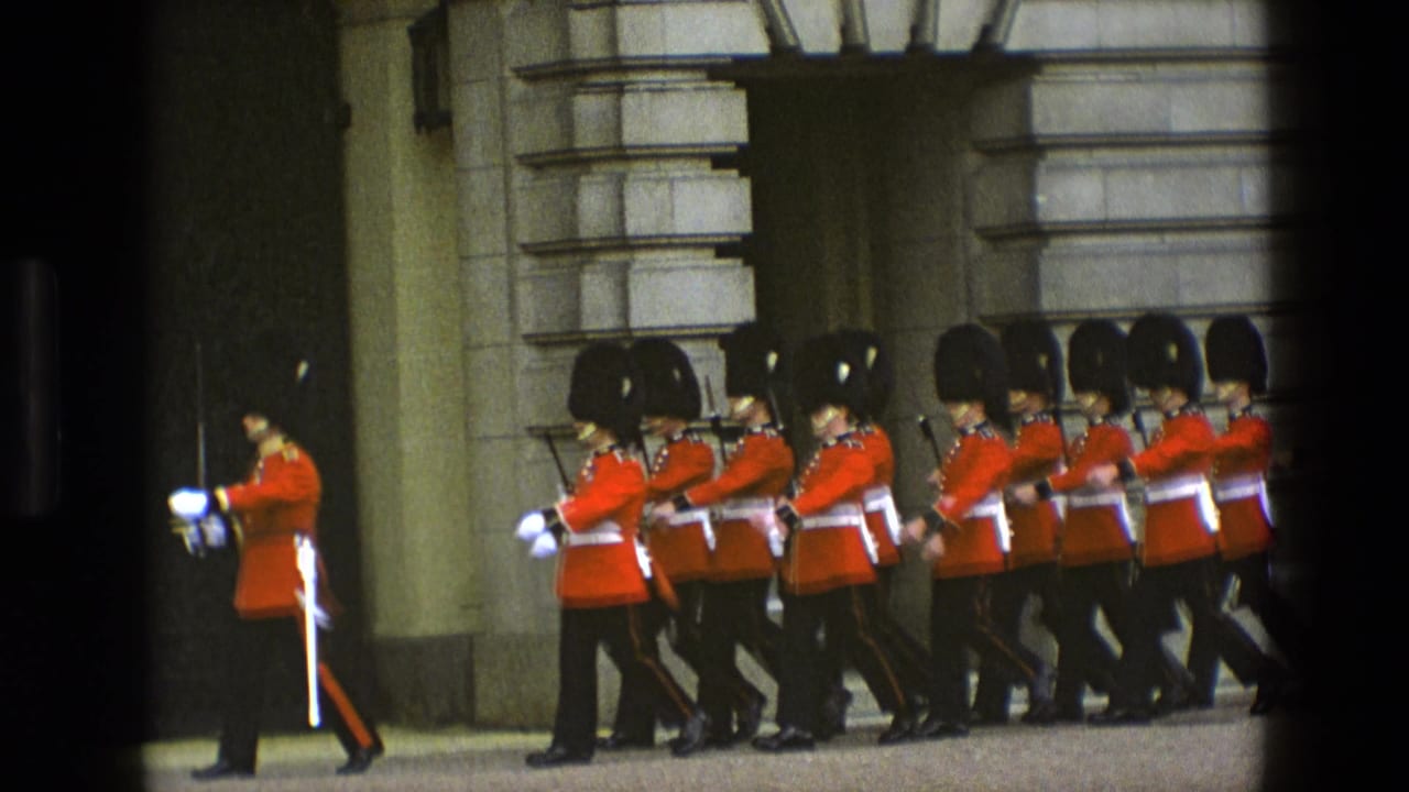 Ceremonial guards march in formation beside a stone facade.